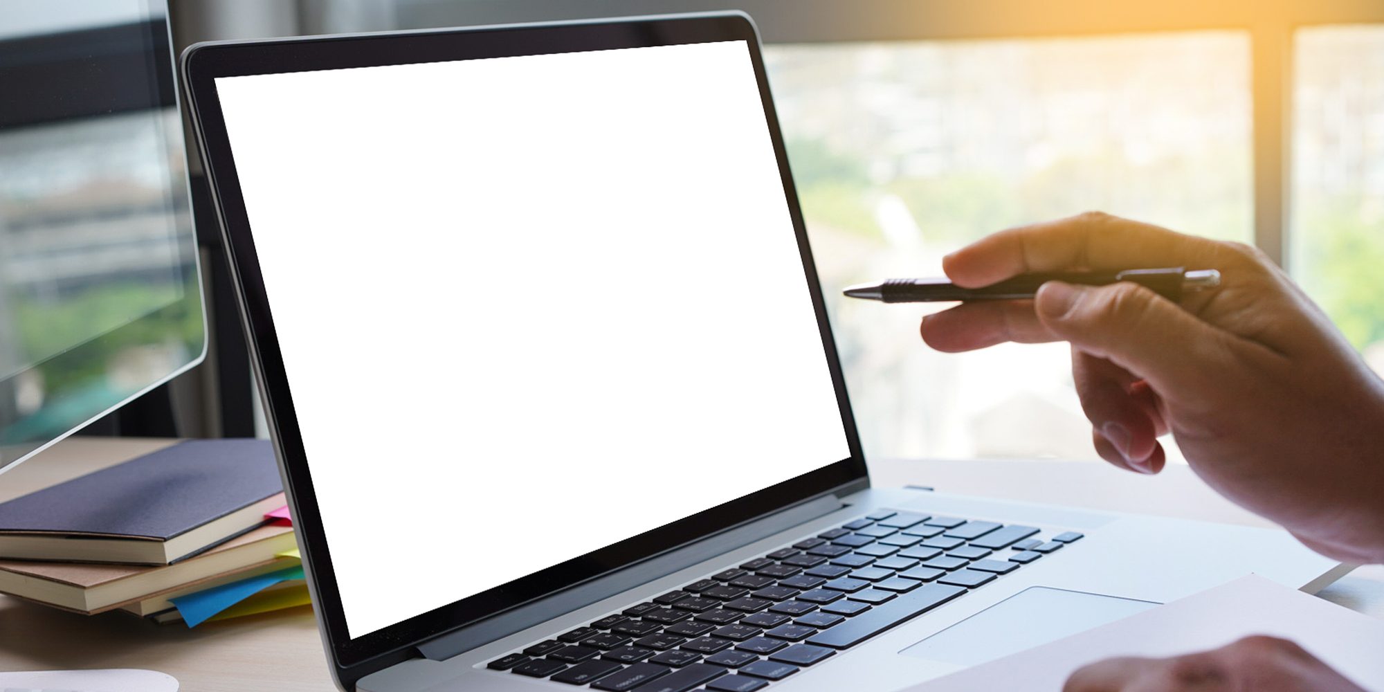 Laptop with blank screen on table. Workspace background new proj